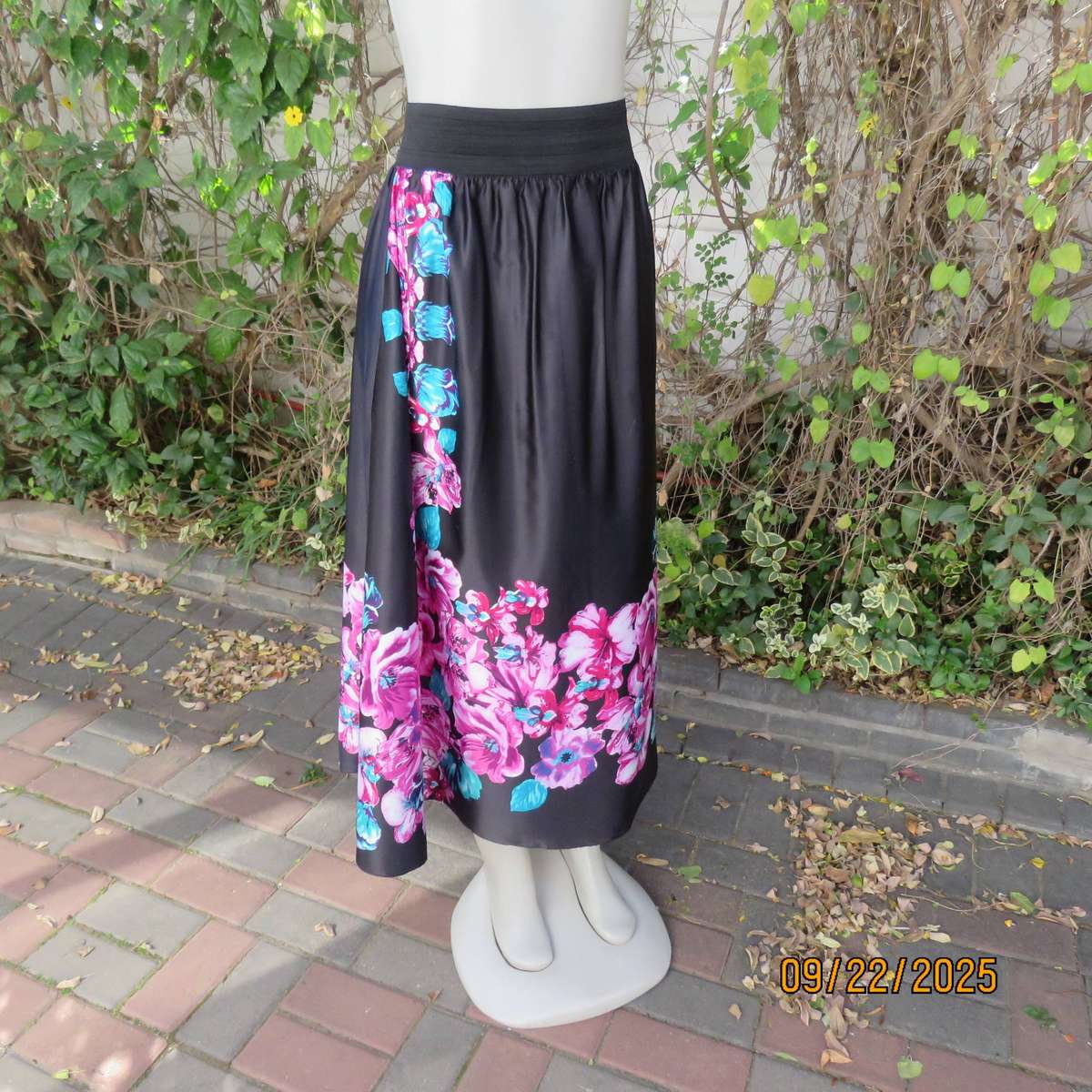 Black silky shiny polyester with pink-jade bold floral print maxi skirt. Elasticated waist. Size 42