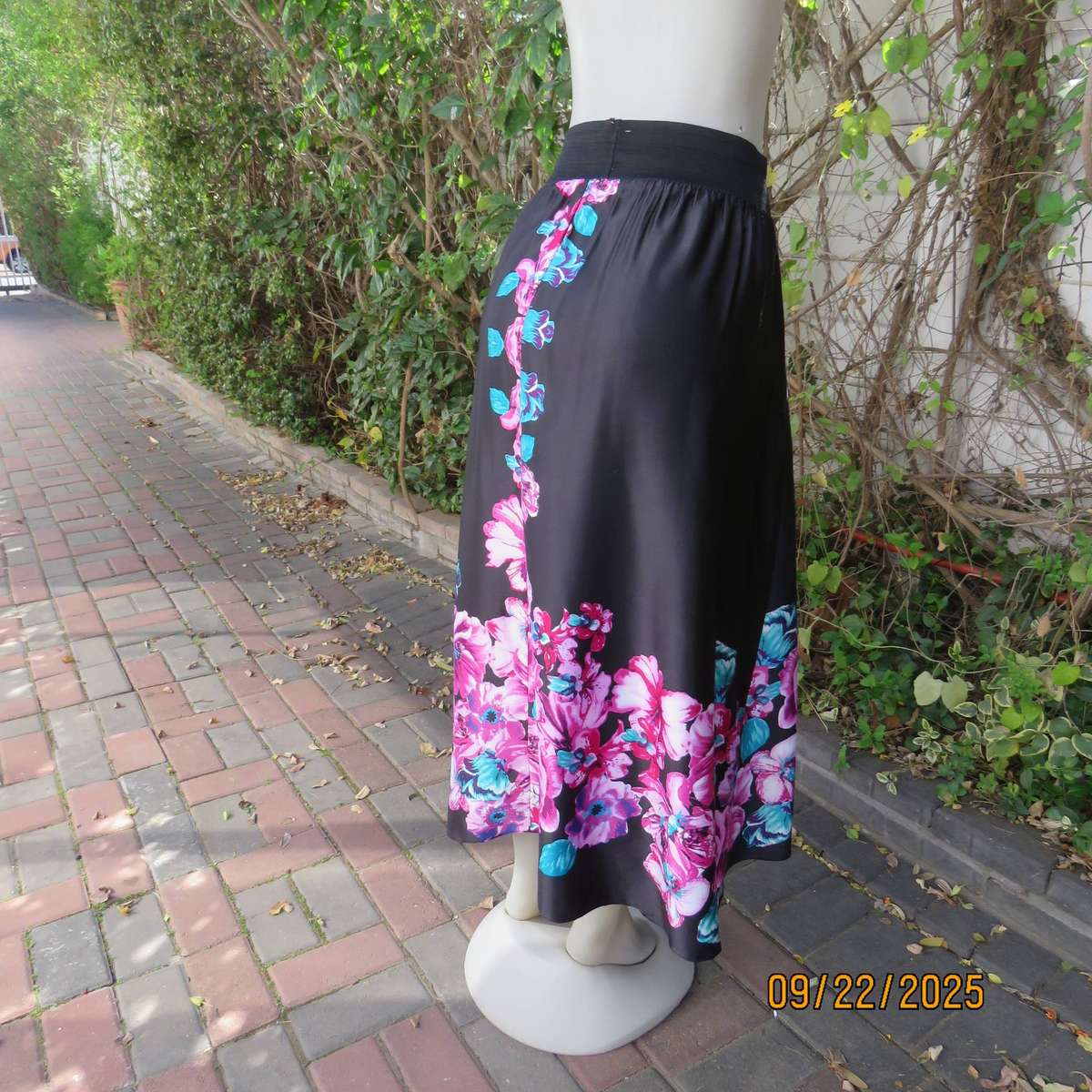 Black silky shiny polyester with pink-jade bold floral print maxi skirt. Elasticated waist. Size 42