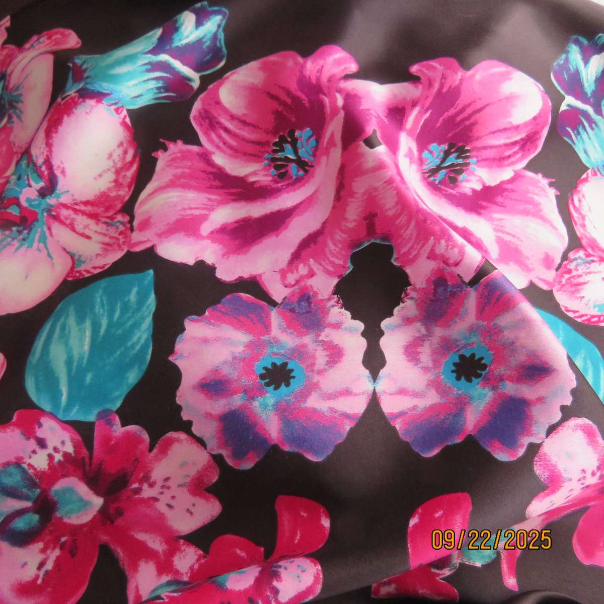 Black silky shiny polyester with pink-jade bold floral print maxi skirt. Elasticated waist. Size 42