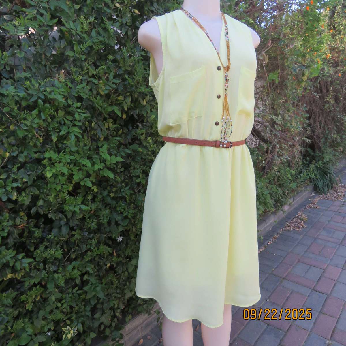 Lemon yellow sheer polyester lined dress with elasticated waist. Size 36