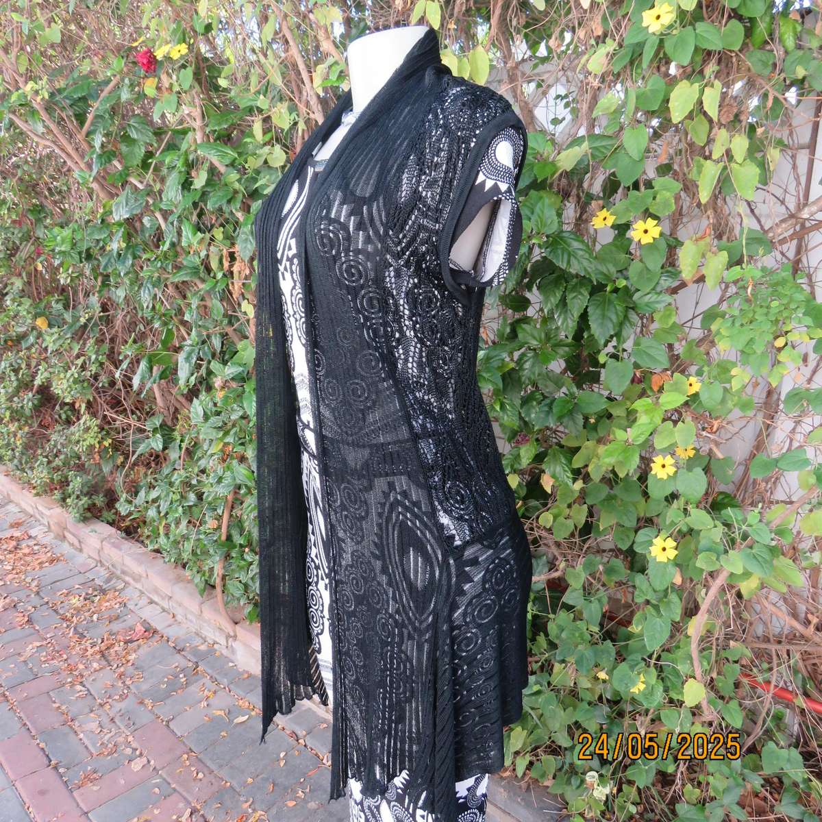 Black acrylic knit lace stitch sleeveless waterfall style cover up. Size 32.