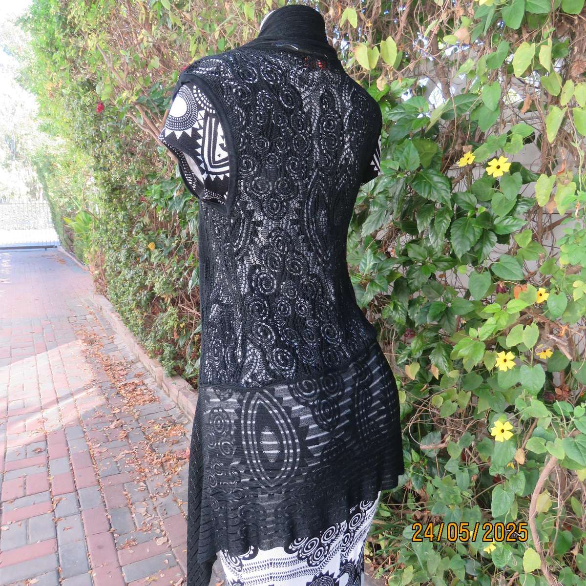 Black acrylic knit lace stitch sleeveless waterfall style cover up. Size 32.