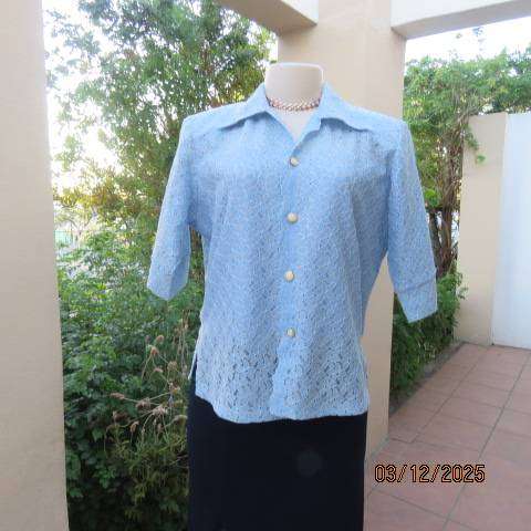 TANG Boutique powder blue special occasion top in polyester with flowers on silver backing. Size 37