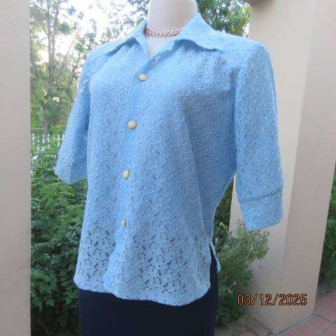 TANG Boutique powder blue special occasion top in polyester with flowers on silver backing. Size 37