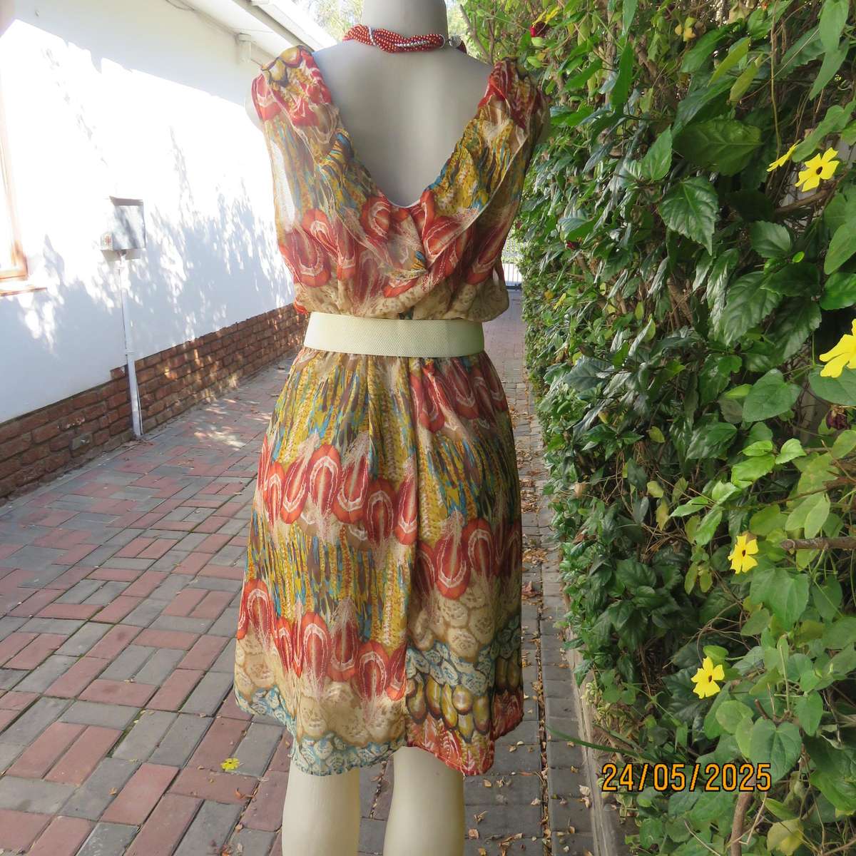 Cool colourful sleeveless dress with frilled V neckline. Size 37. Lined. Elasticated waist.