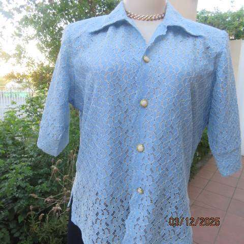 TANG Boutique powder blue special occasion top in polyester with flowers on silver backing. Size 37
