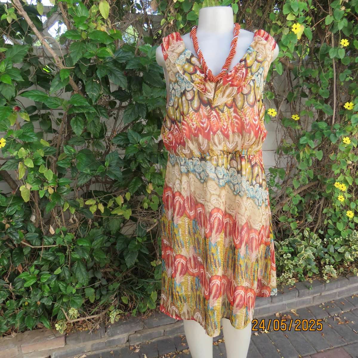 Cool colourful sleeveless dress with frilled V neckline. Size 37. Lined. Elasticated waist.