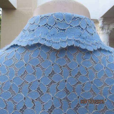 TANG Boutique powder blue special occasion top in polyester with flowers on silver backing. Size 37