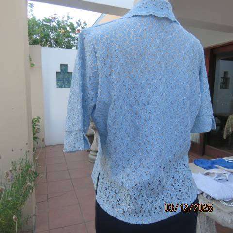 TANG Boutique powder blue special occasion top in polyester with flowers on silver backing. Size 37
