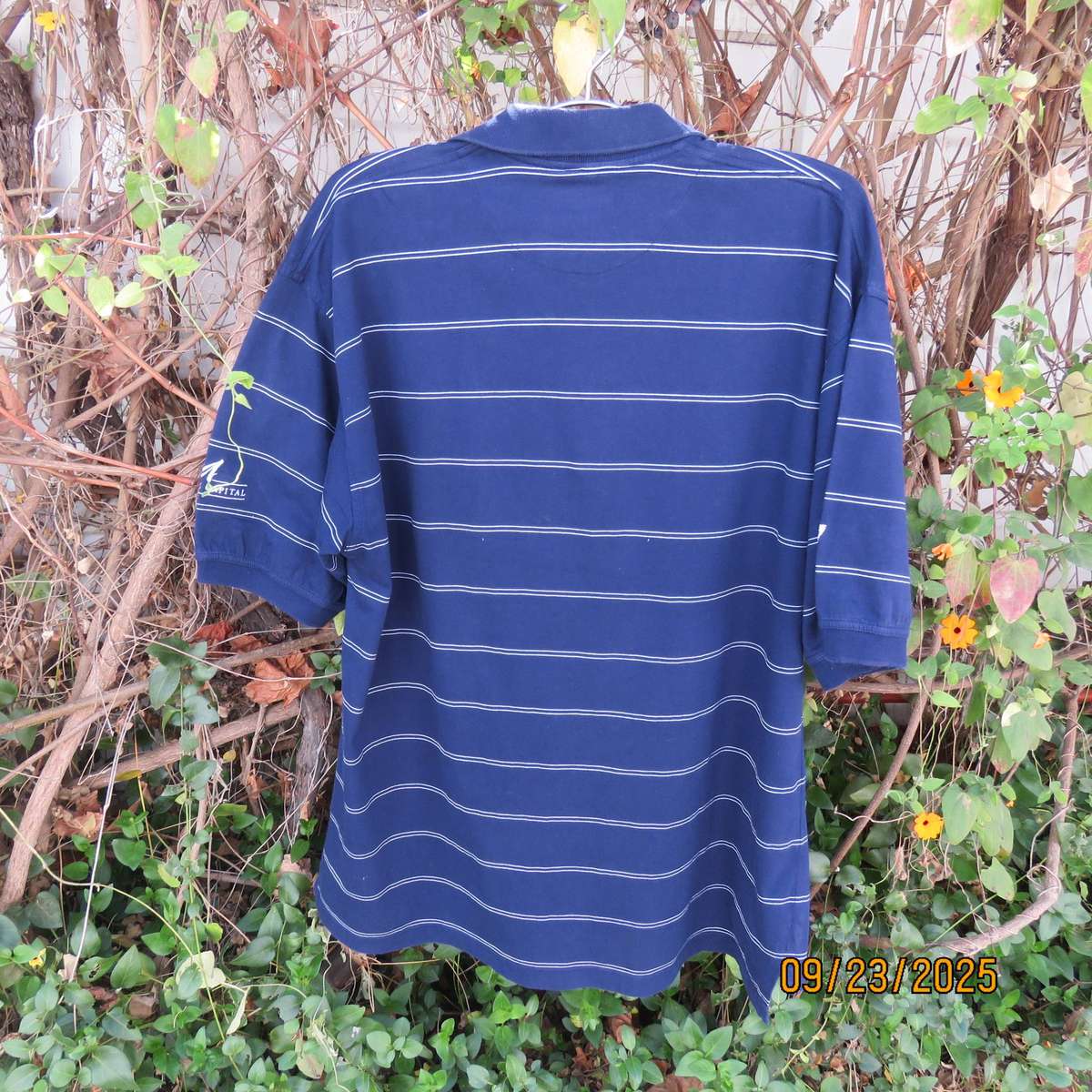 SWAGG navy with thin horizontal white stripe golf short sleeve shirt. Size XL.