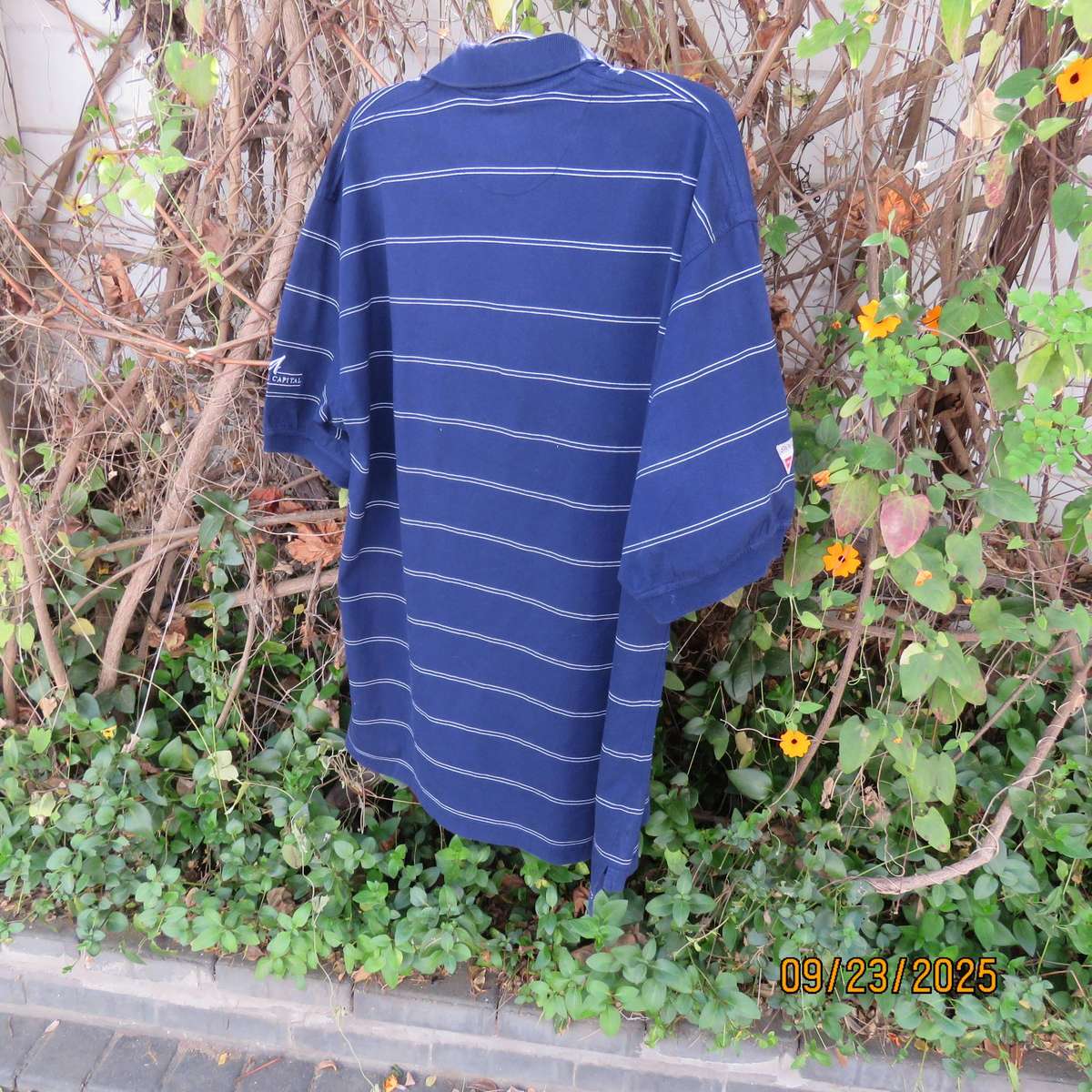 SWAGG navy with thin horizontal white stripe golf short sleeve shirt. Size XL.