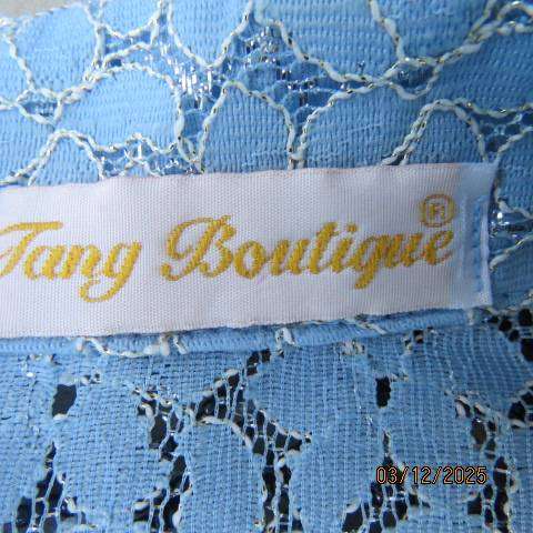 TANG Boutique powder blue special occasion top in polyester with flowers on silver backing. Size 37