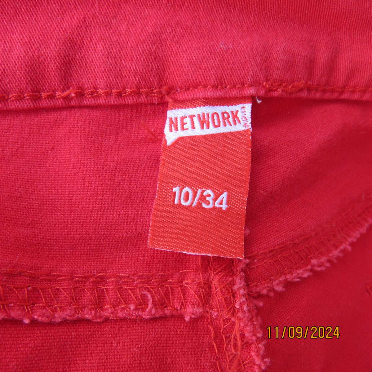 Sexy postbox red skinny cotton stretch pants size 35. Pockets front and back. Stud decoration.