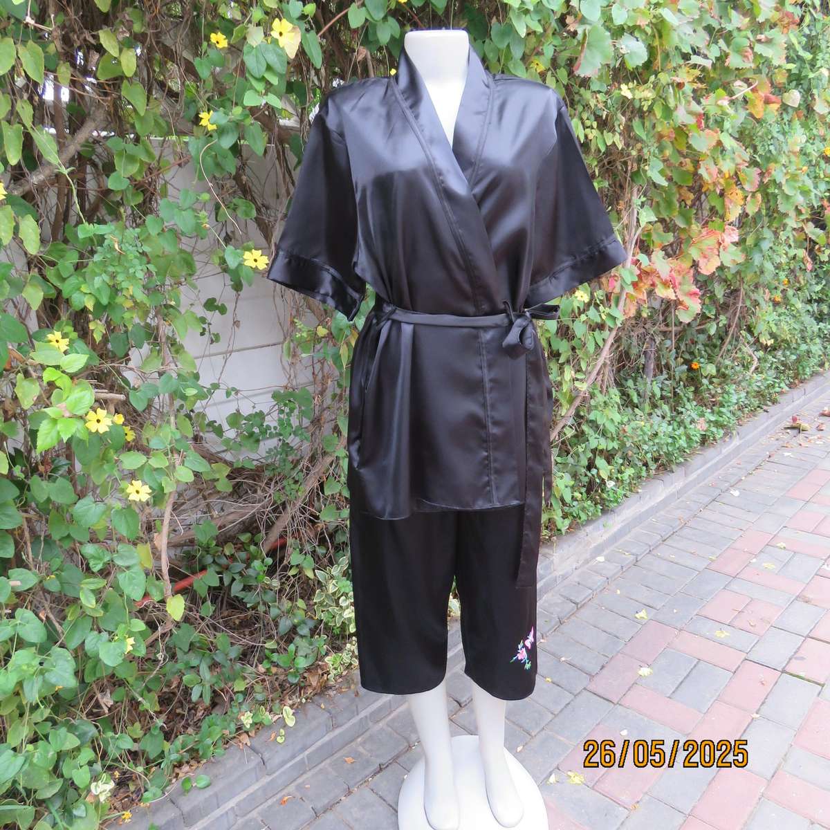 Black 2 pc satin polyester pajama set. Cropped pants-fold over top. Size 36-38