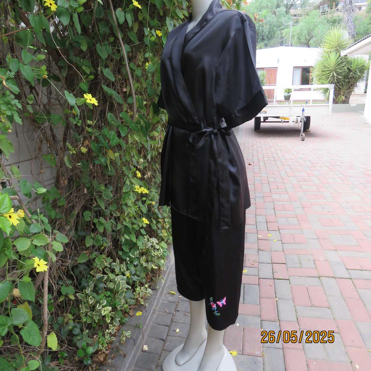 Black 2 pc satin polyester pajama set. Cropped pants-fold over top. Size 36-38