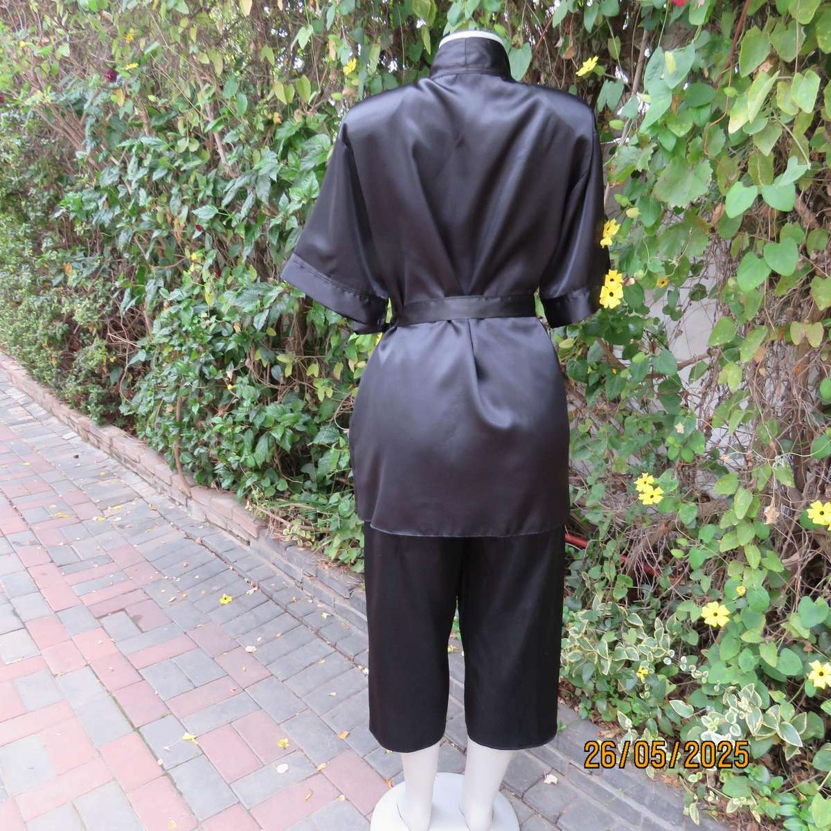 Black 2 pc satin polyester pajama set. Cropped pants-fold over top. Size 36-38