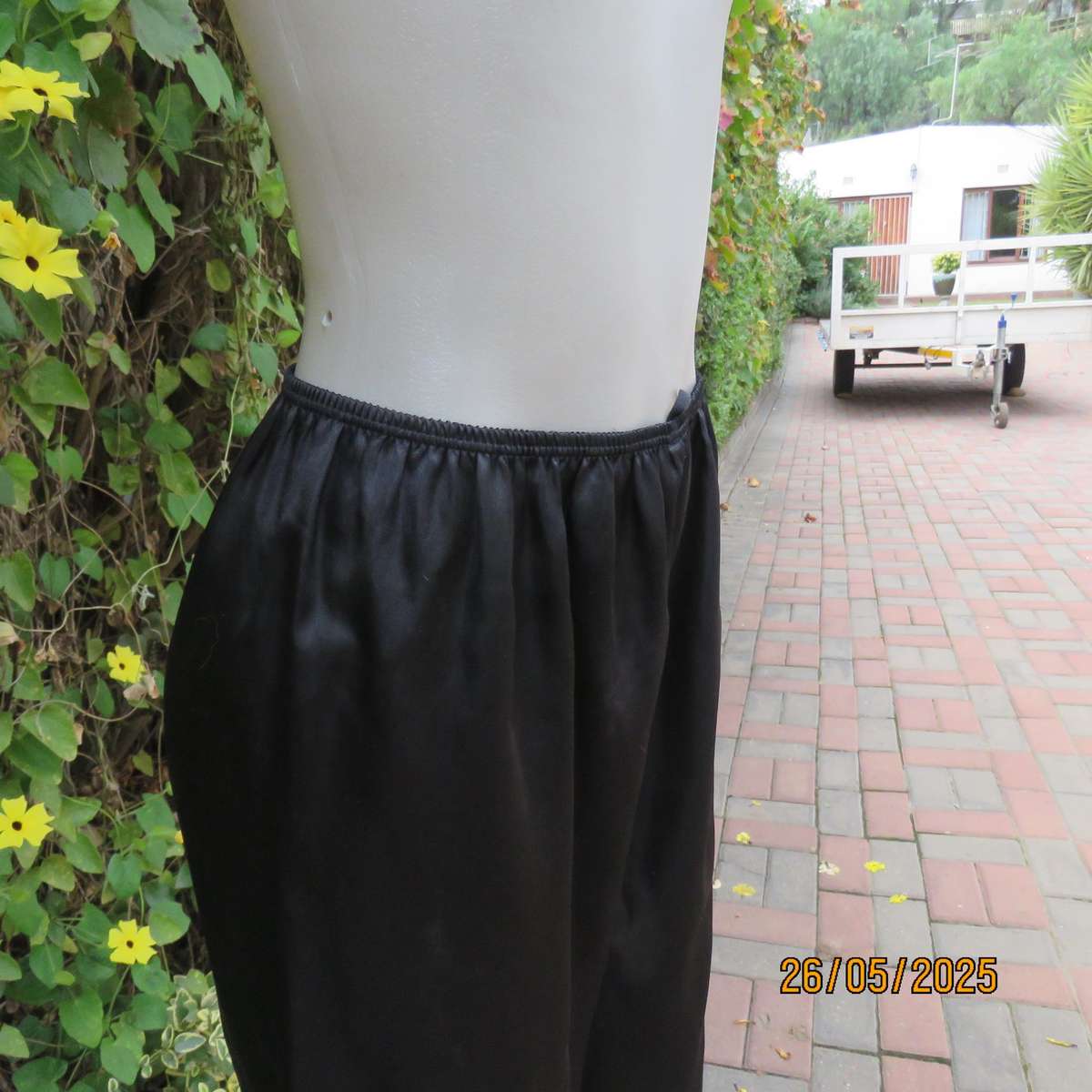 Black 2 pc satin polyester pajama set. Cropped pants-fold over top. Size 36-38