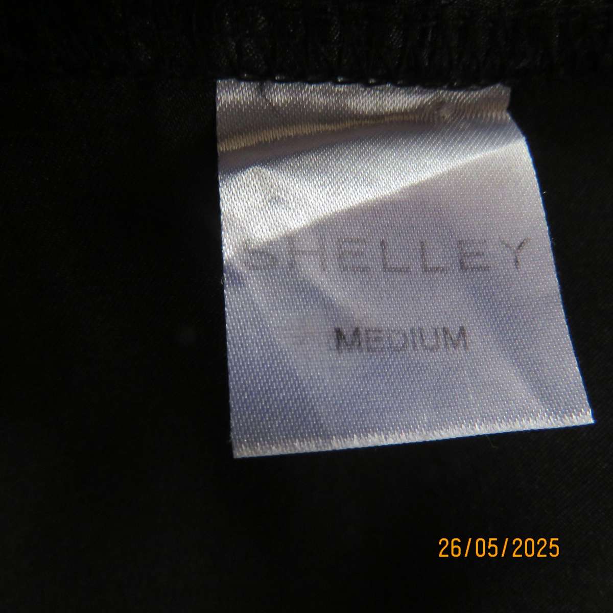 Black 2 pc satin polyester pajama set. Cropped pants-fold over top. Size 36-38