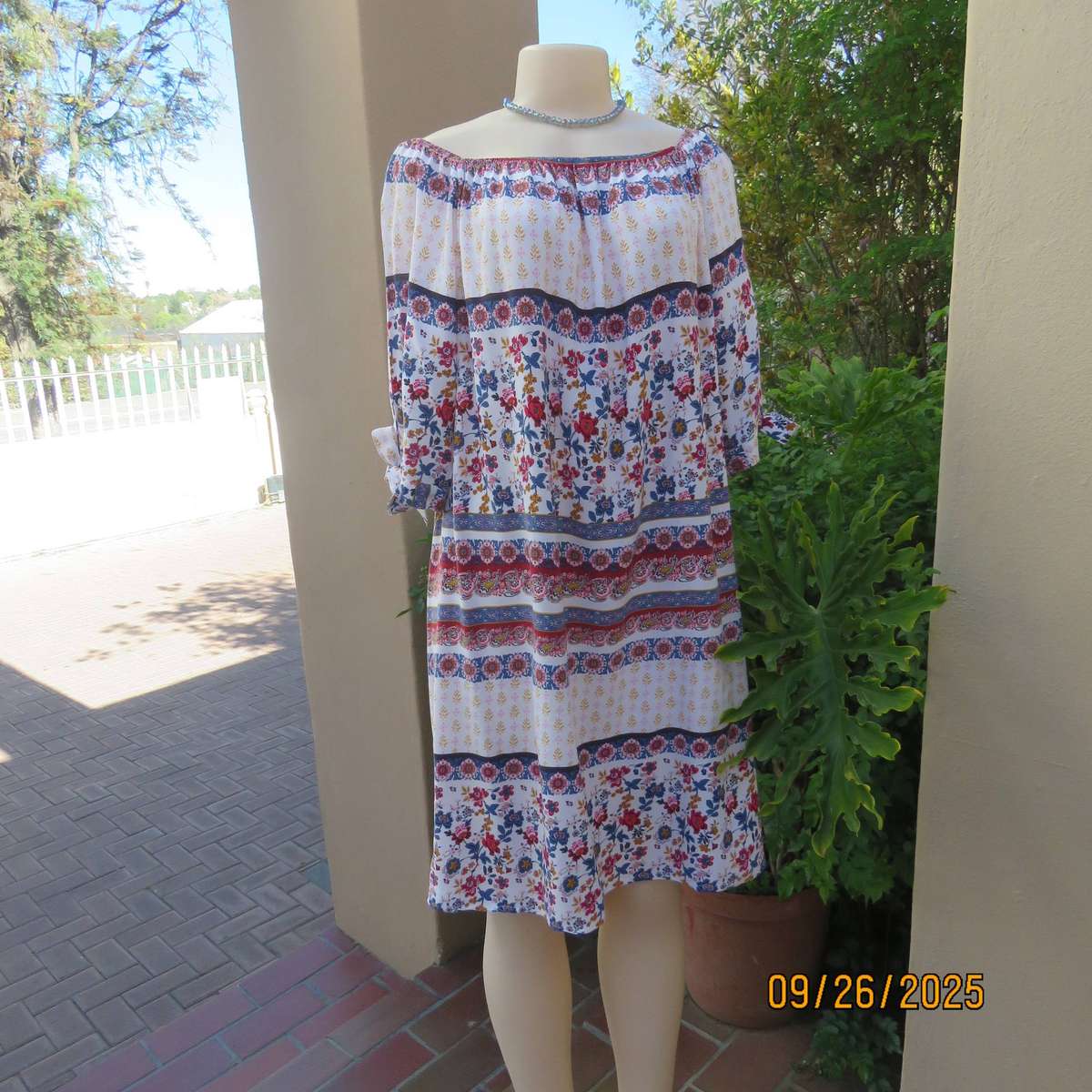 EXACT white viscose with blue-red flowers and horizontal lines. Size 42.