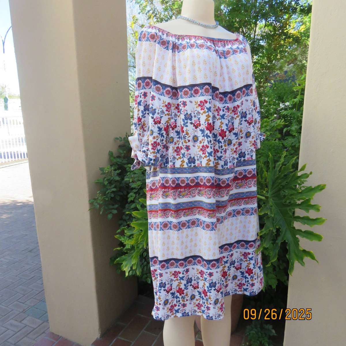 EXACT white viscose with blue-red flowers and horizontal lines. Size 42.