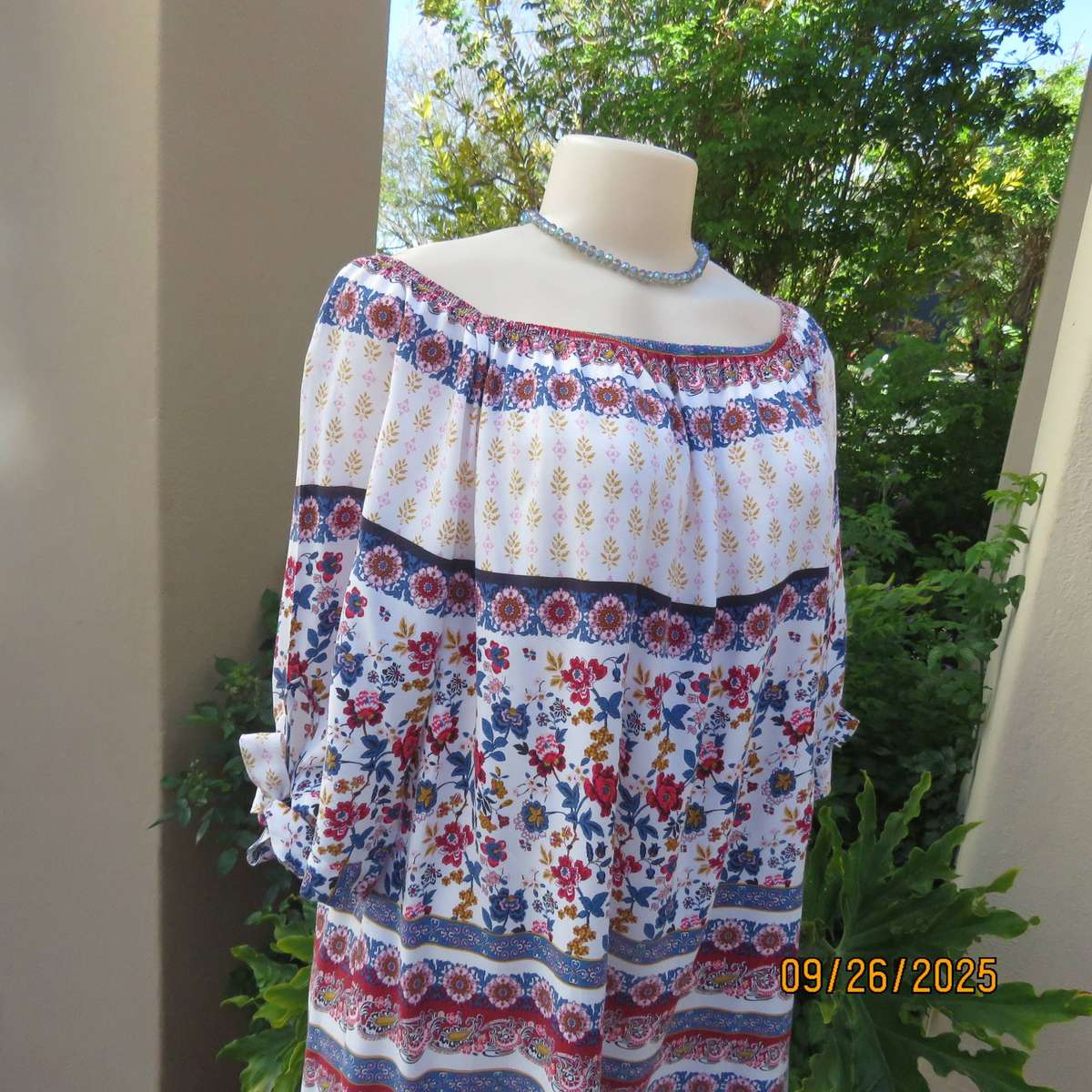 EXACT white viscose with blue-red flowers and horizontal lines. Size 42.
