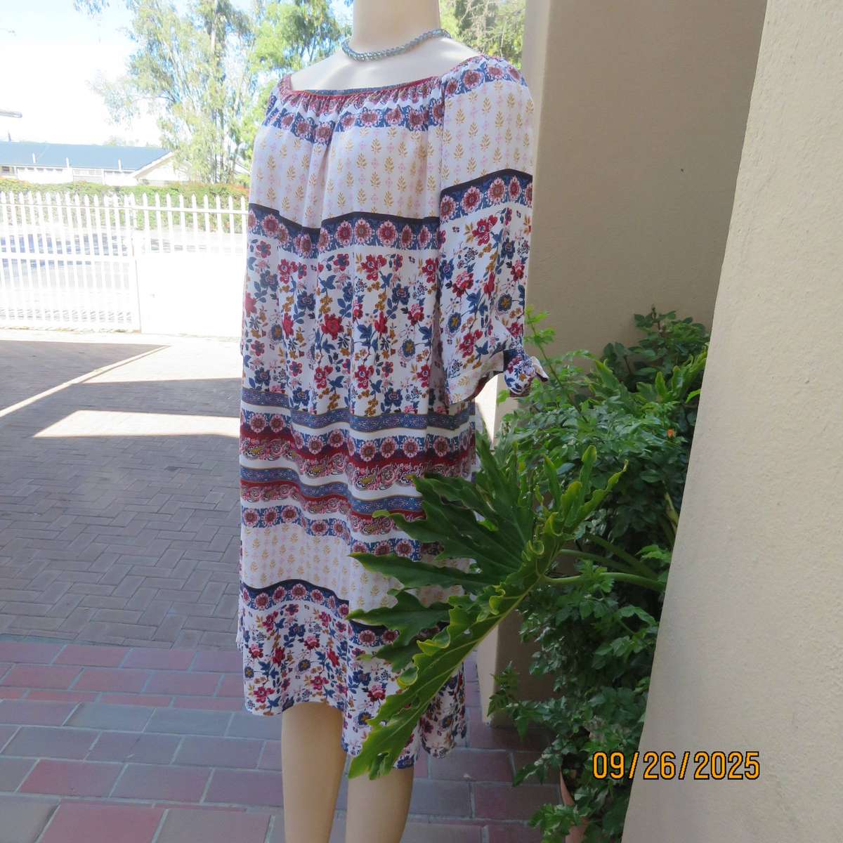 EXACT white viscose with blue-red flowers and horizontal lines. Size 42.