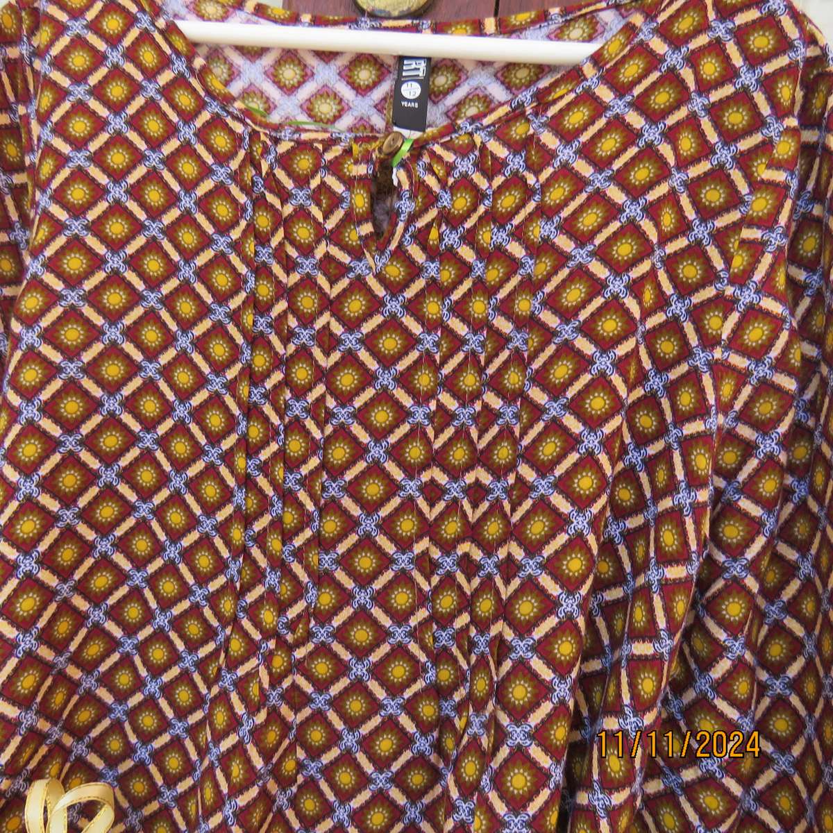 Pretty long sleeve loose  slip over dress in autumn colours.By RT for 11 to 12 yr old. In viscose.