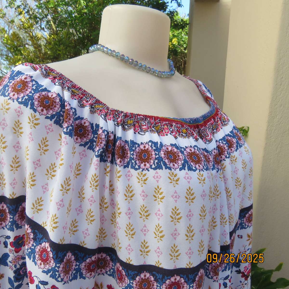 EXACT white viscose with blue-red flowers and horizontal lines. Size 42.