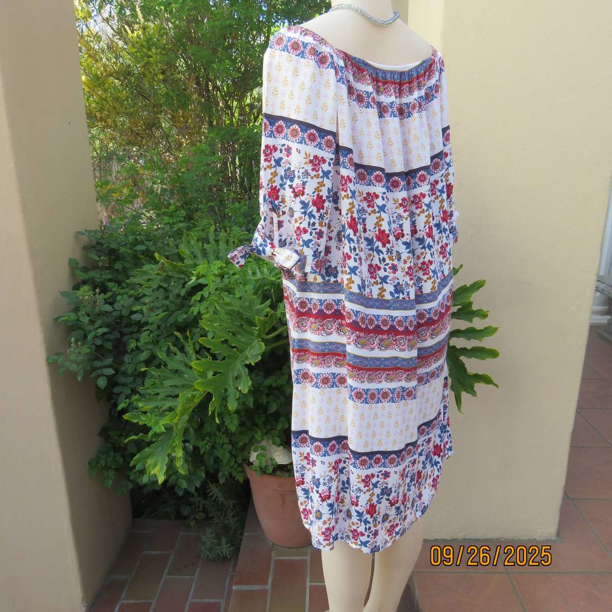 EXACT white viscose with blue-red flowers and horizontal lines. Size 42.