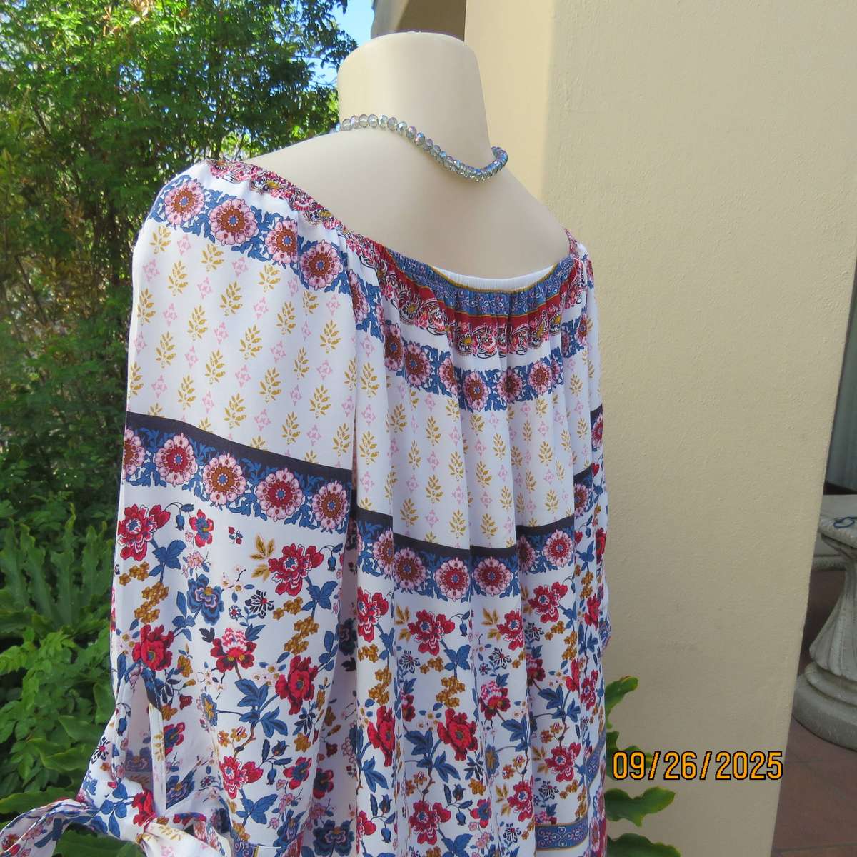 EXACT white viscose with blue-red flowers and horizontal lines. Size 42.