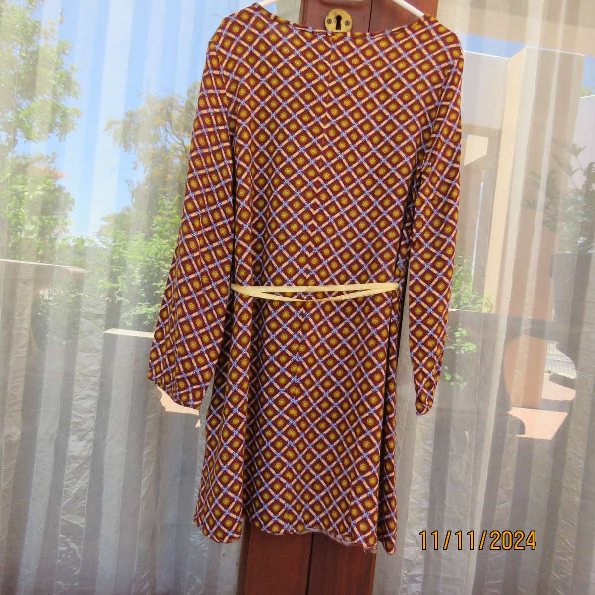 Pretty long sleeve loose  slip over dress in autumn colours.By RT for 11 to 12 yr old. In viscose.