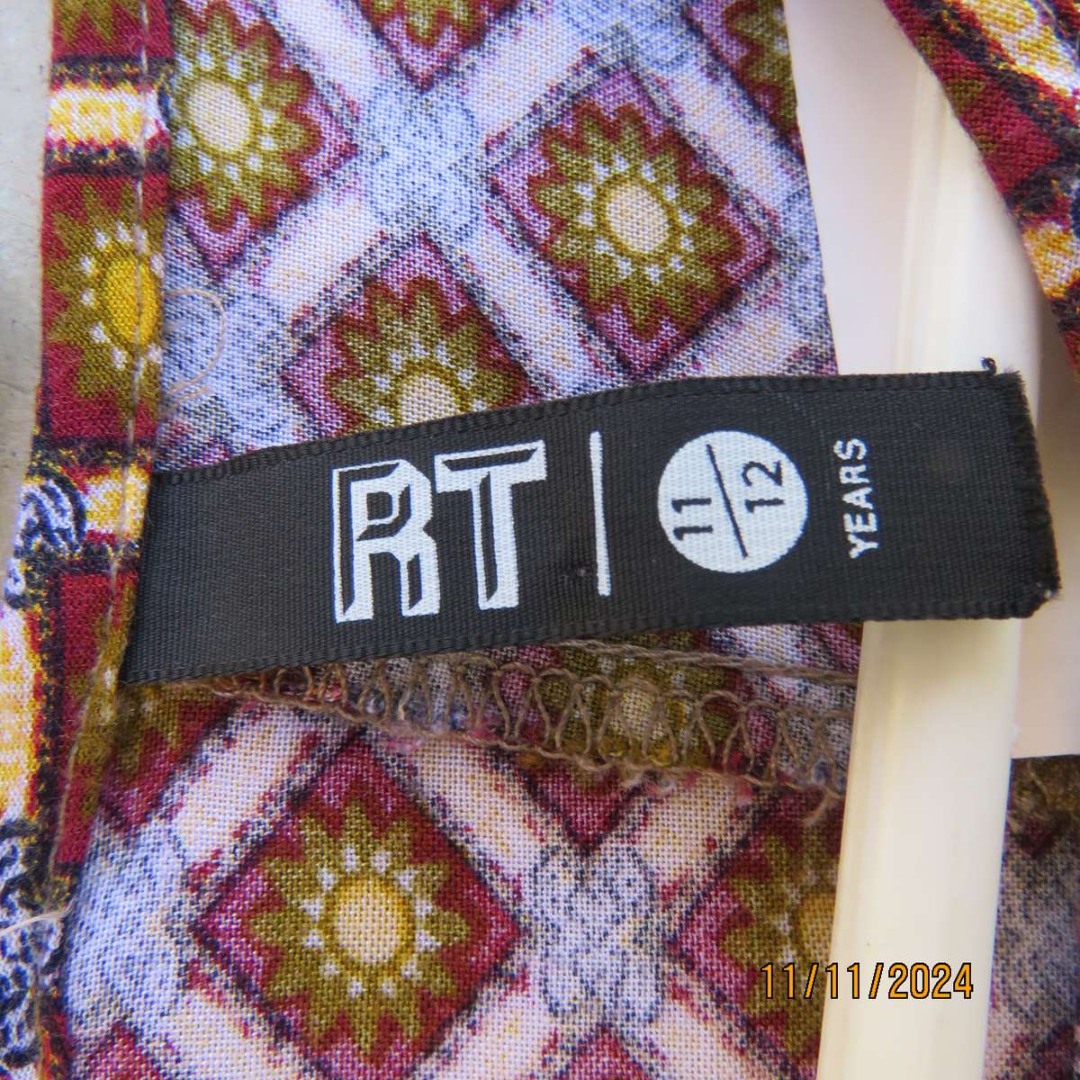 Pretty long sleeve loose  slip over dress in autumn colours.By RT for 11 to 12 yr old. In viscose.