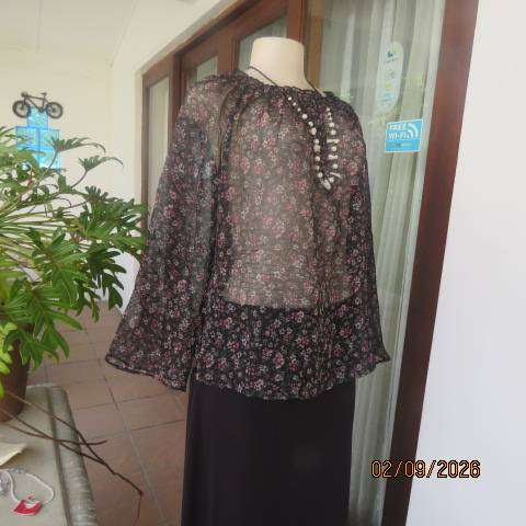 Black crinkled sheer polyester long raglan sleeve top with tiny pink and white floral print size 40