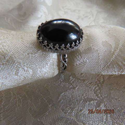 Black oval onyx ring in 925 sterling silver setting, size 8