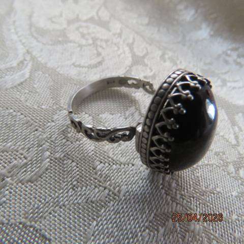 Black oval onyx ring in 925 sterling silver setting, size 8