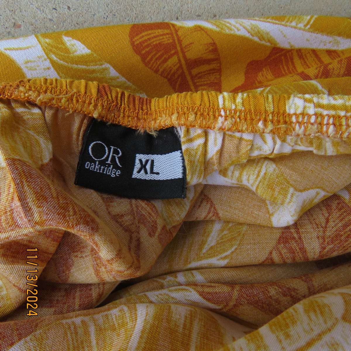 Summertime chic mustard with white-rust leaf design slip over top. Size 42 by RED. Off the shoulder