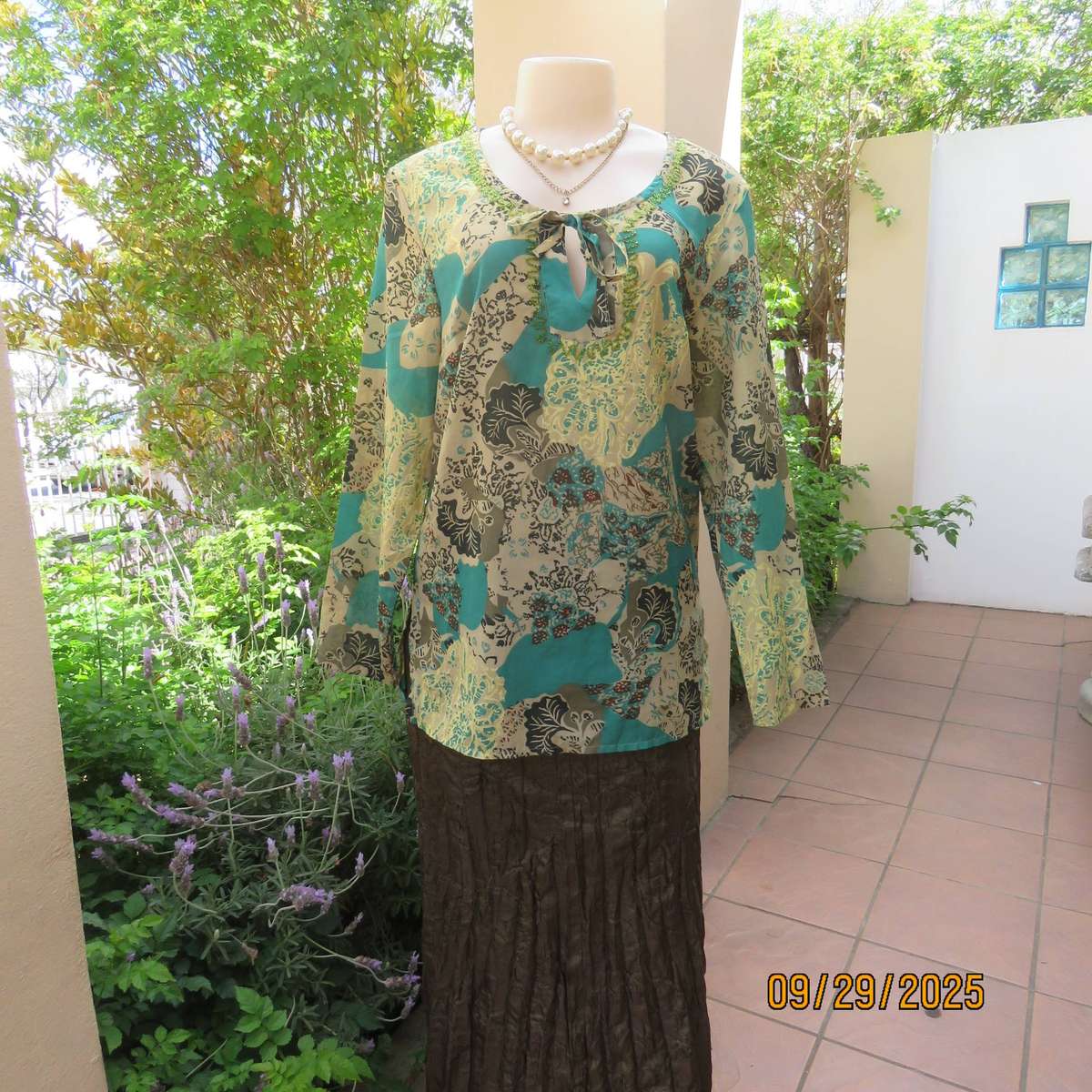 Colourful long sleeve polyester top with green bead decoration. Size 36