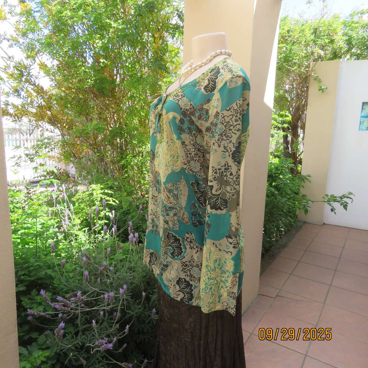 Colourful long sleeve polyester top with green bead decoration. Size 36