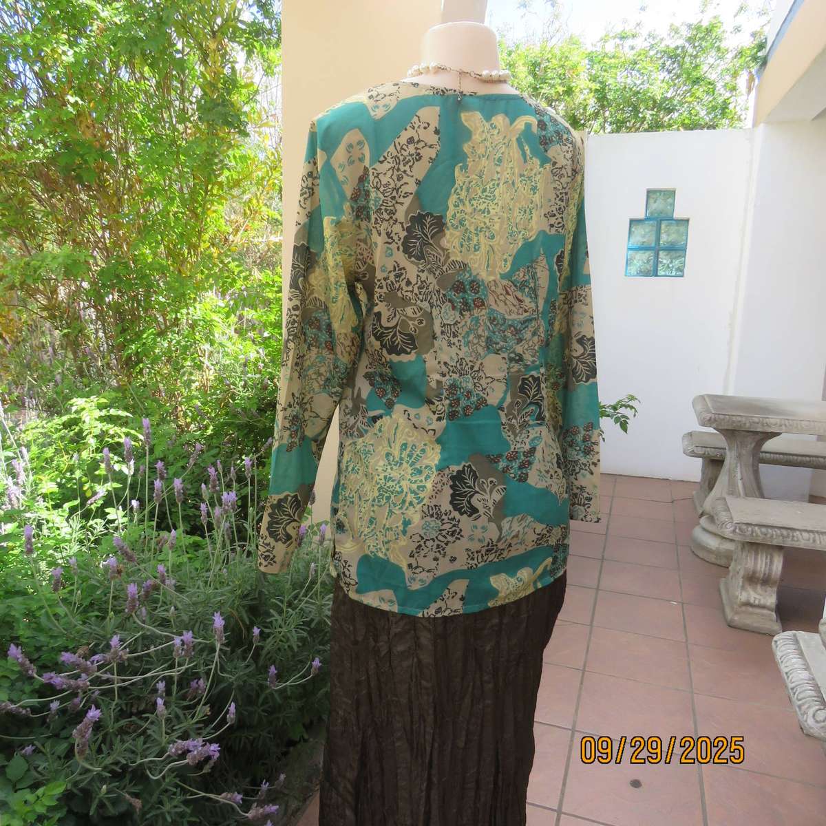 Colourful long sleeve polyester top with green bead decoration. Size 36