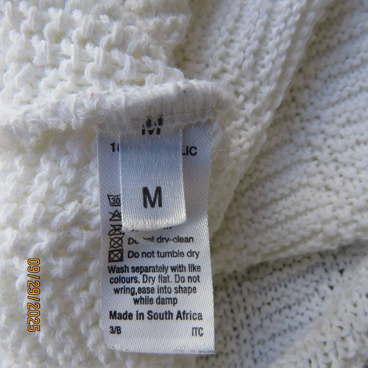 OASIS white long acrylic knit sleeveless slip over top. Slitted sides. Size 38