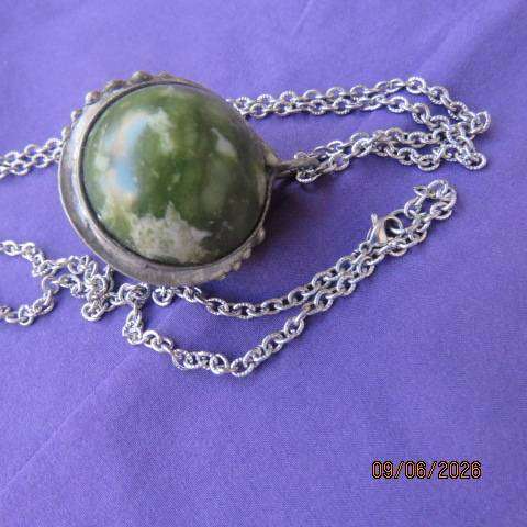 Canadian Jade round polished gemstone pendant in bezel setting with silvery chain