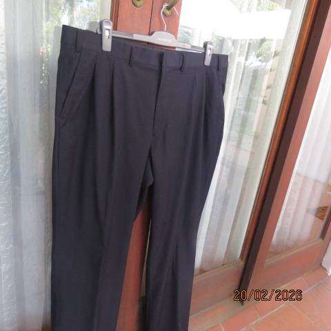 WOOLWORTHS black pleated front dress pants with side and back pockets, size 42