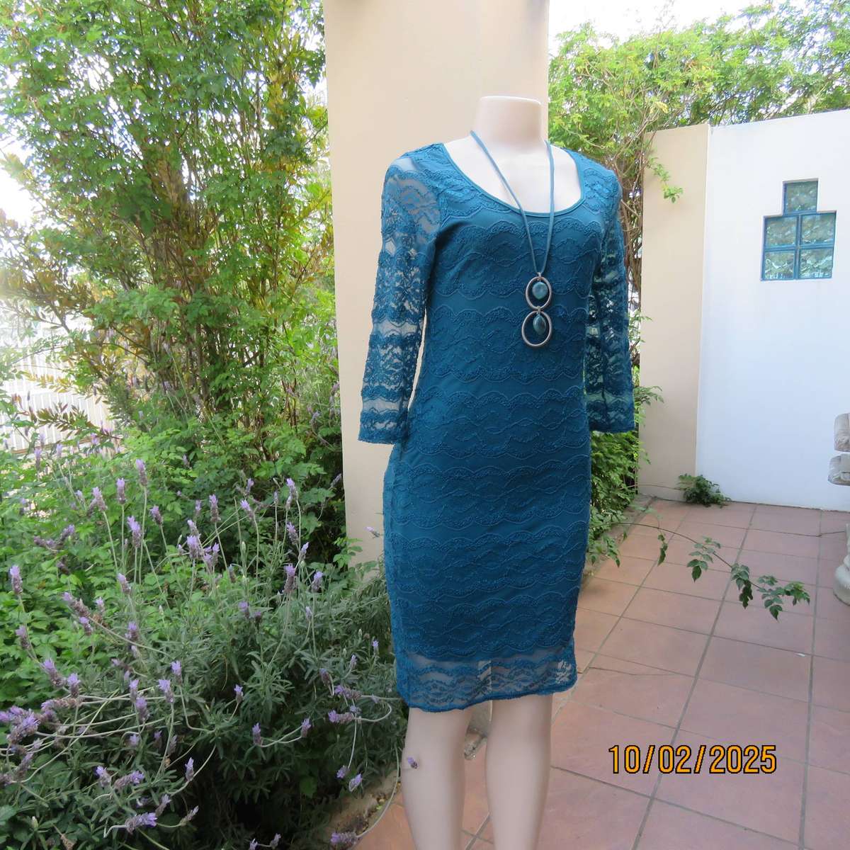 Jade stretch polyester lace bodycon dress with stretch lining. Bracelet length sleeves. Size 34