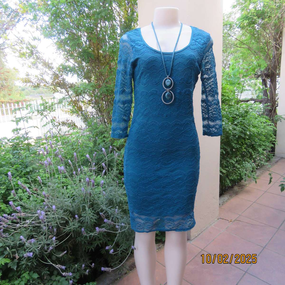 Jade stretch polyester lace bodycon dress with stretch lining. Bracelet length sleeves. Size 34