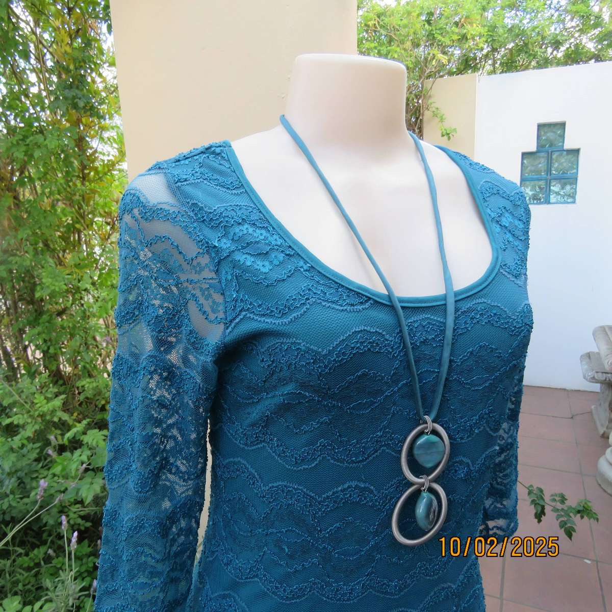 Jade stretch polyester lace bodycon dress with stretch lining. Bracelet length sleeves. Size 34