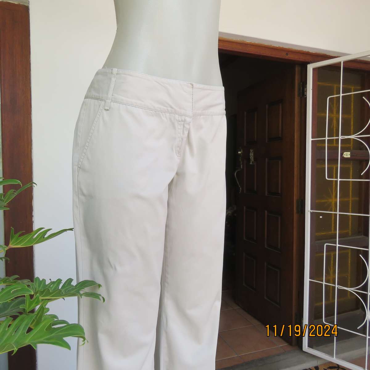 WOOLWORTHS top of the line bootlegged beige cotton pants size 36.