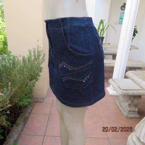 Boutique made 100% blue denim mini jean skirt with cargo front pockets. Size 32