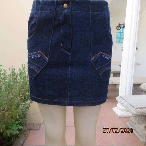 Boutique made 100% blue denim mini jean skirt with cargo front pockets. Size 32
