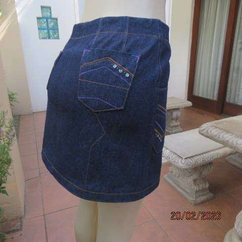 Boutique made 100% blue denim mini jean skirt with cargo front pockets. Size 32
