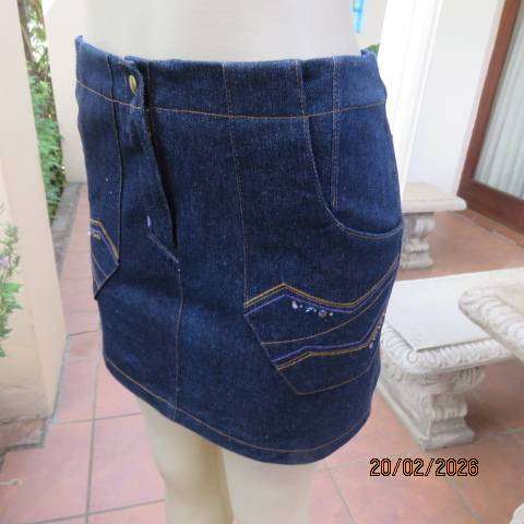 Boutique made 100% blue denim mini jean skirt with cargo front pockets. Size 32